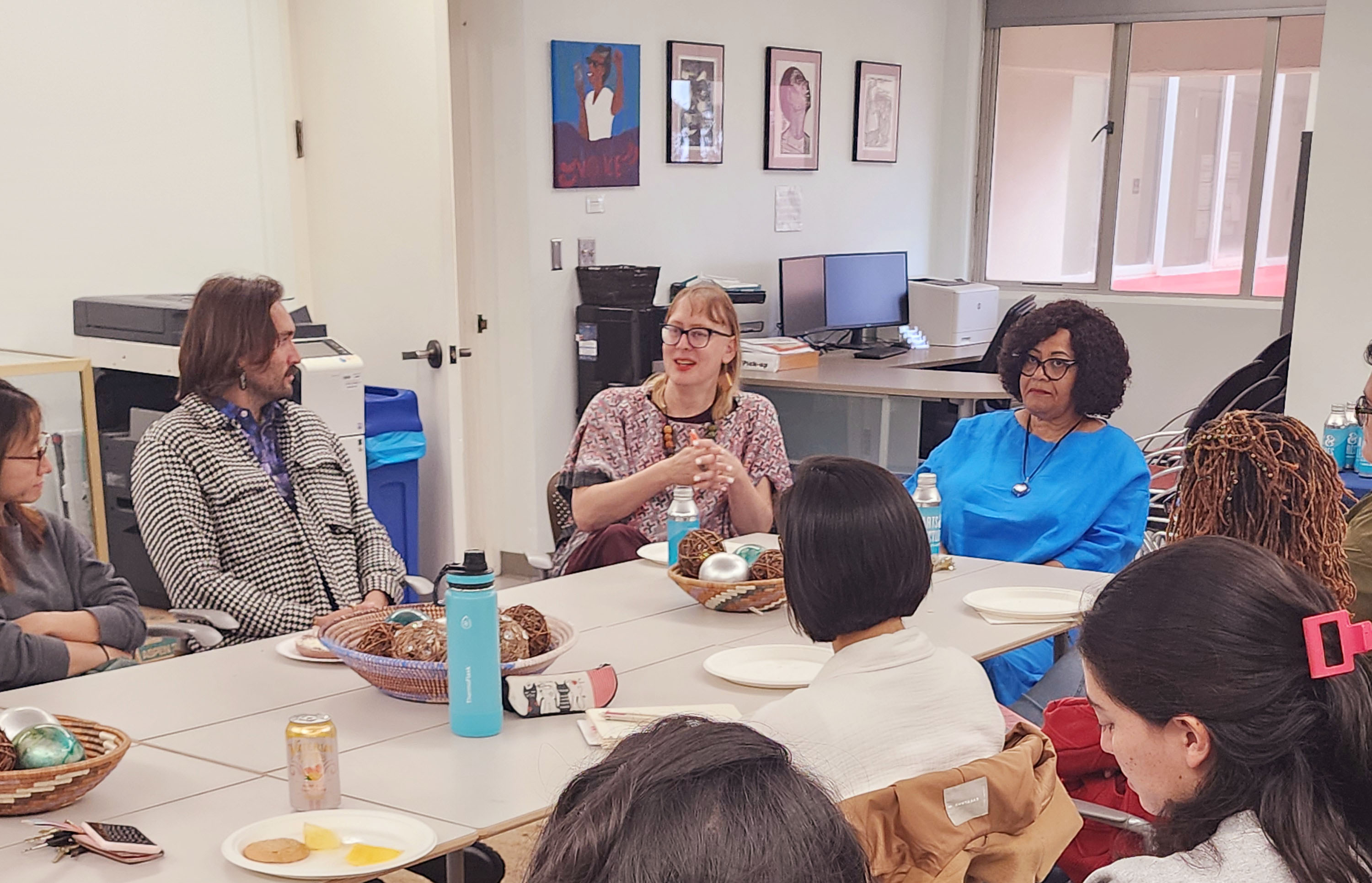Sharon and students talking at a roundtable