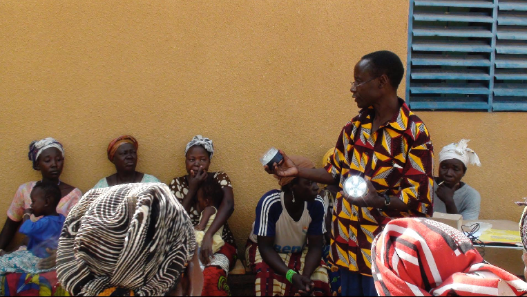 a man presents a solar lamps 