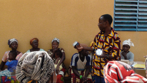 a man presents a solar lamps