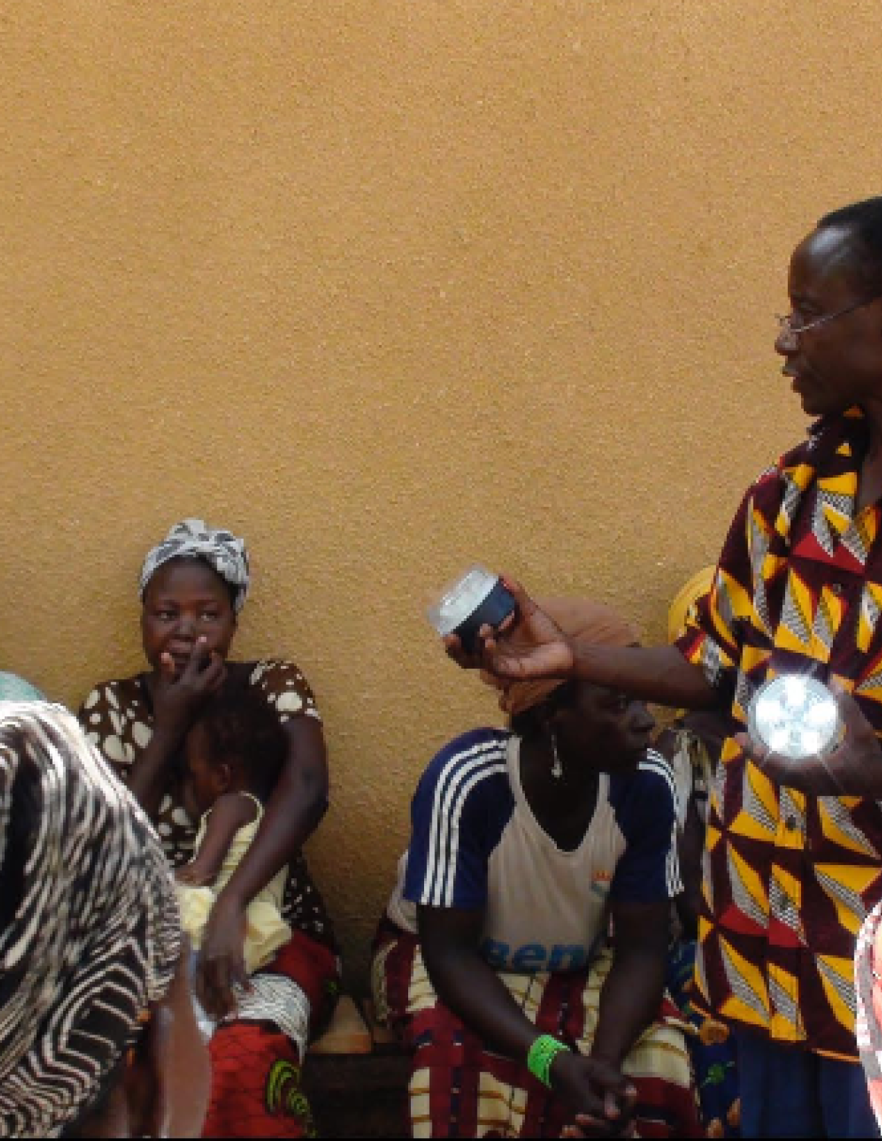 a man presents a solar lamps 