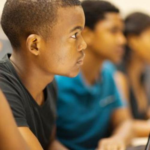 kids paying attentionwhile sitting at their desks